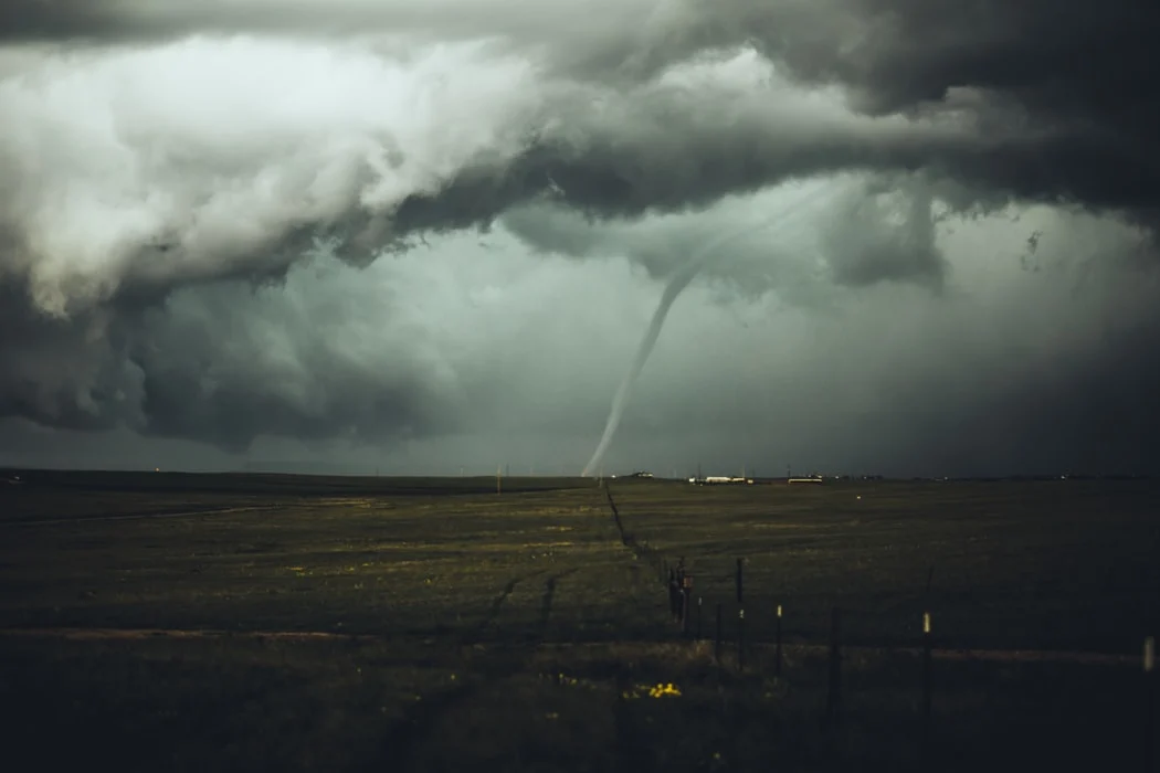 tornado next to barndominium