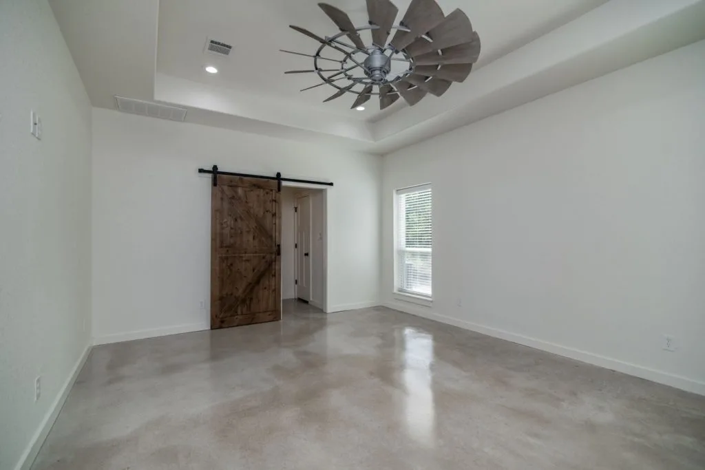 Texas Barndominium master bedroom door to bathroom