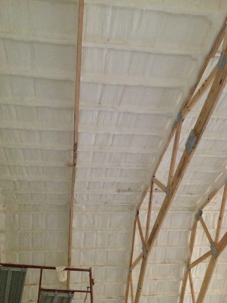 Spray foam insulation covers the ceiling and walls. 
