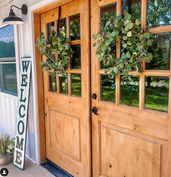 Double front doors with wreath decor