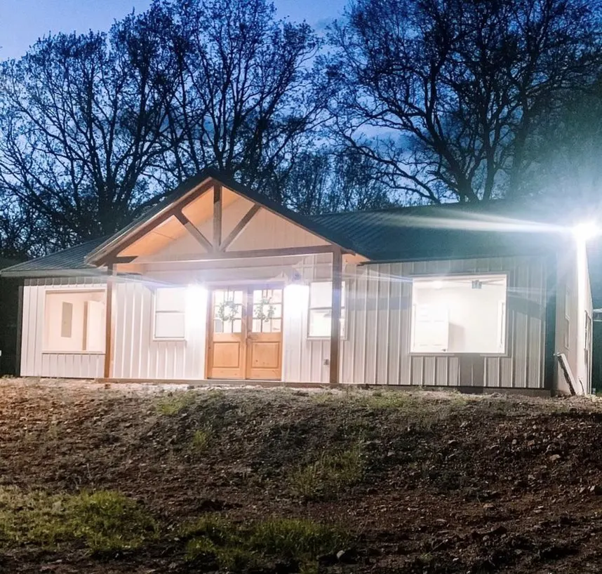Exterior image at night with lights