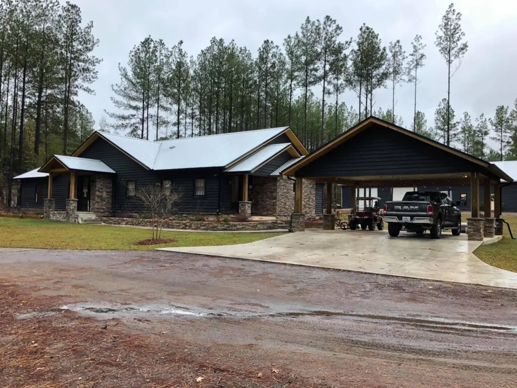 Odom Family Barndominium front view with parking space