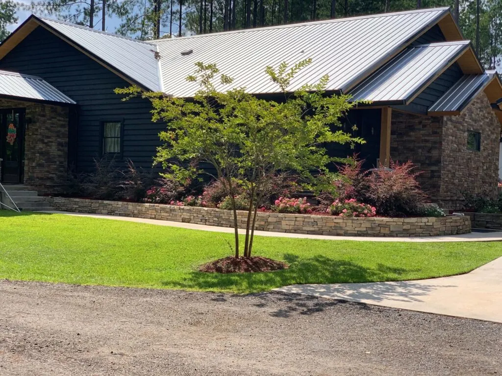 Barndominium front view with beautiful landscape