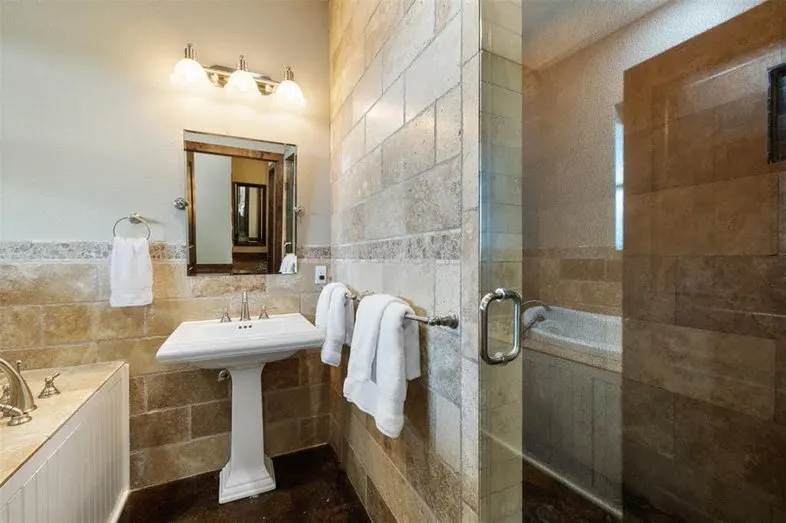 Bathroom with walk-in shower and bath.