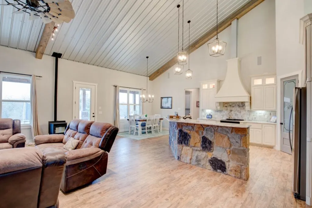 Open concept kitchen, dining, and living space show the benefits of a barndominium