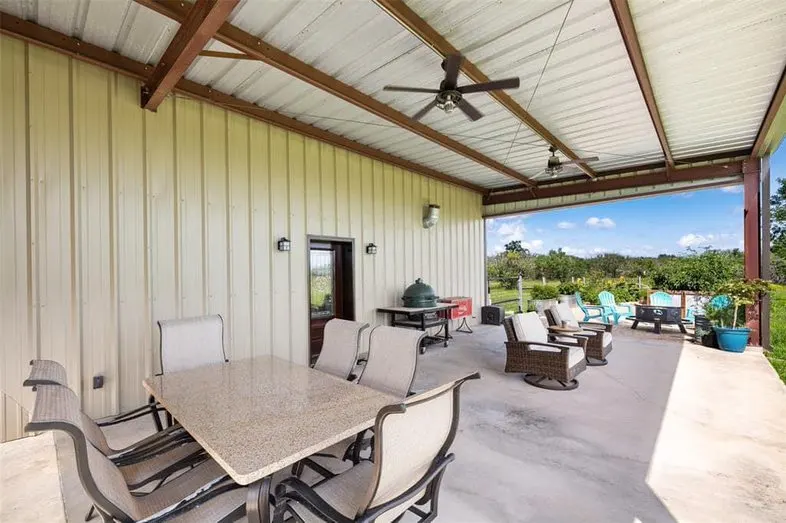 Patio with ceiling fans and seating