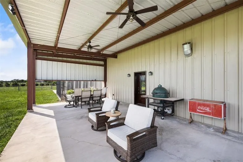 Patio with ceiling fans and seating