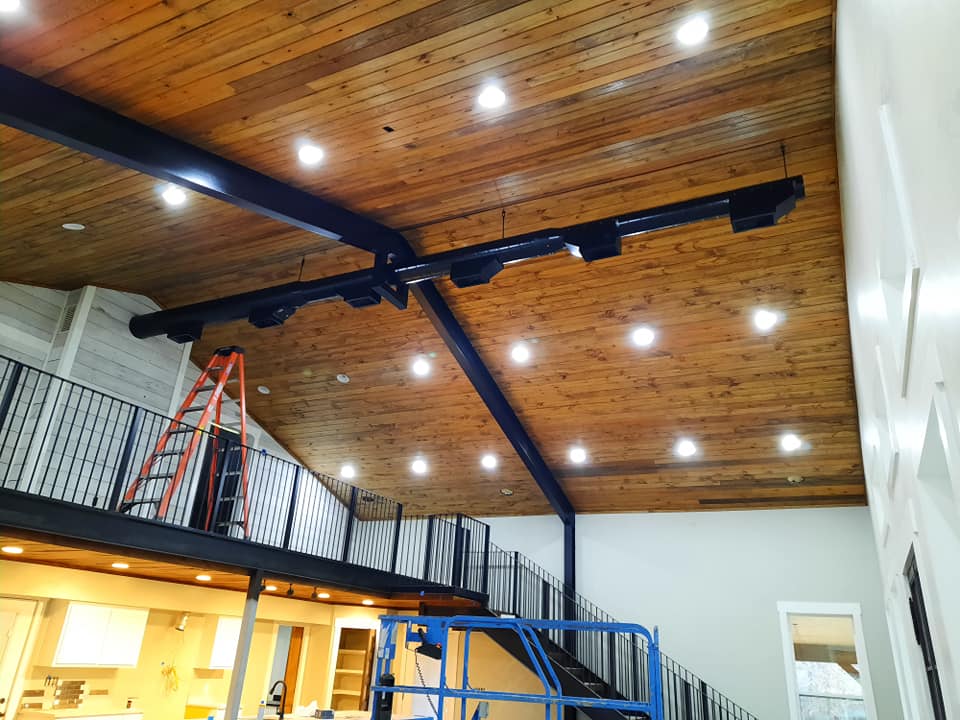 Wood stained ceilings with exposed HVAC