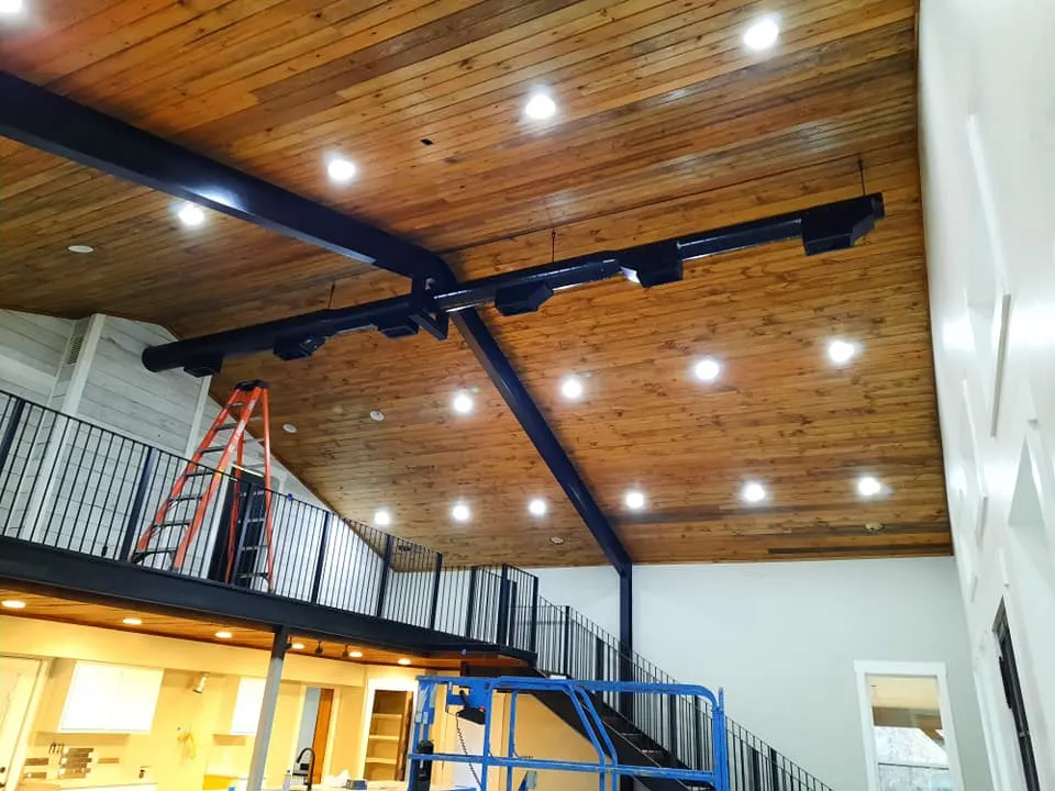 Wood stained ceilings with exposed HVAC