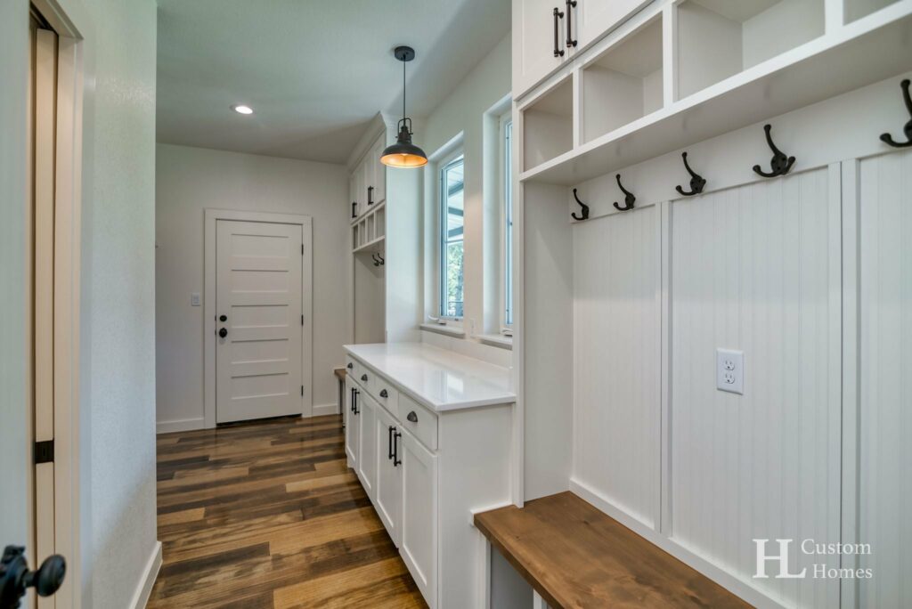Laundry Room with side sliding door connecting to the master closet