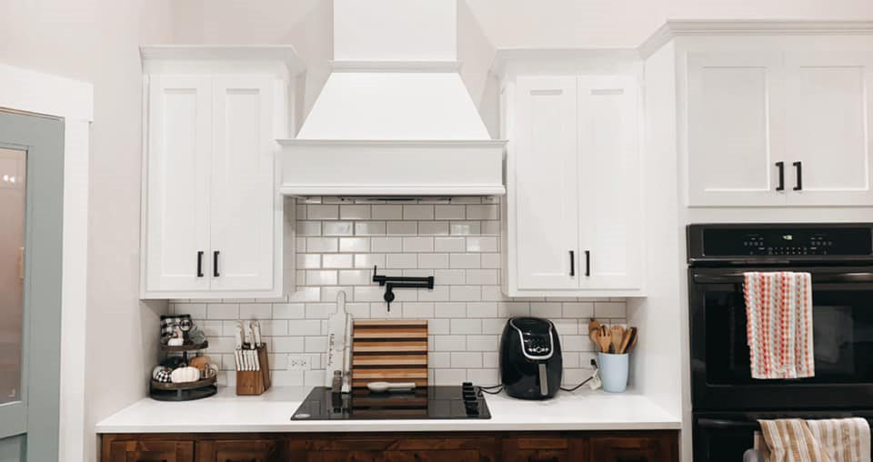 White Kitchen Overhead Cabinets, Counterop, and Backsplash