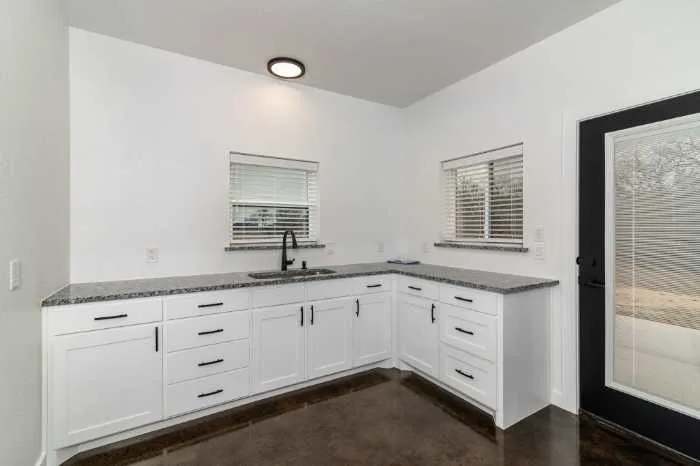 Kitchen sink with white storage areas