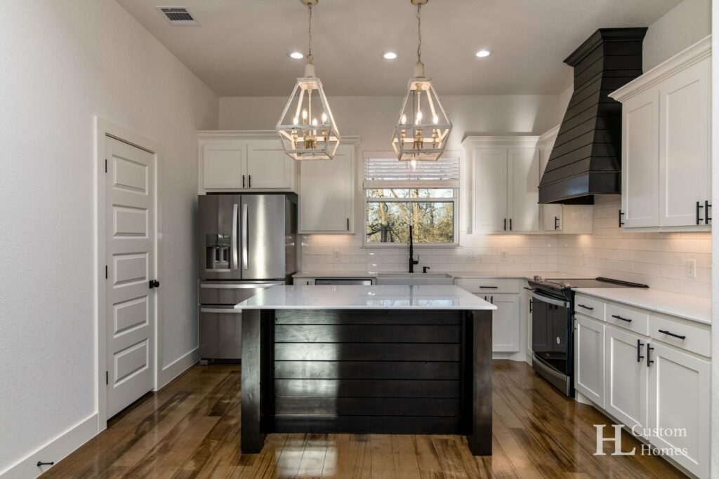 Black and white kitchen area with center island