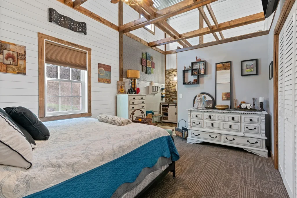 Pole barn bedroom with timber beams 